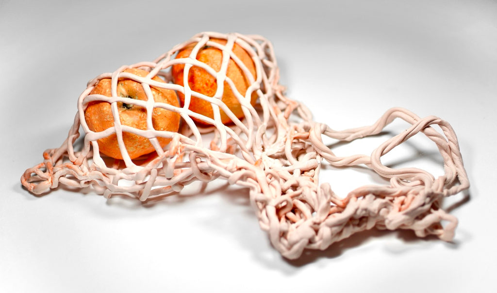 Pink net with oranges